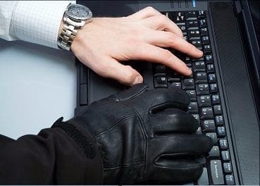 Wire fraud hands on keyboard